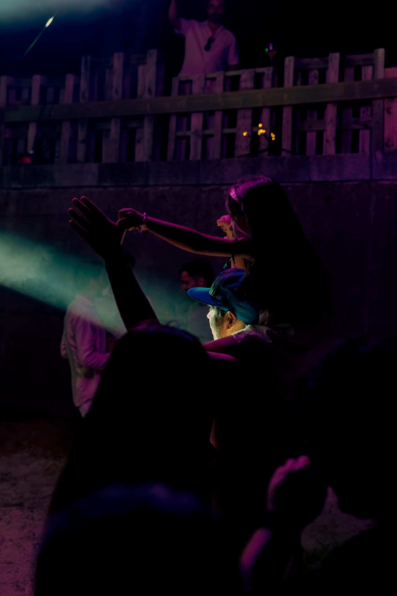 Dancing silhouettes under purple light