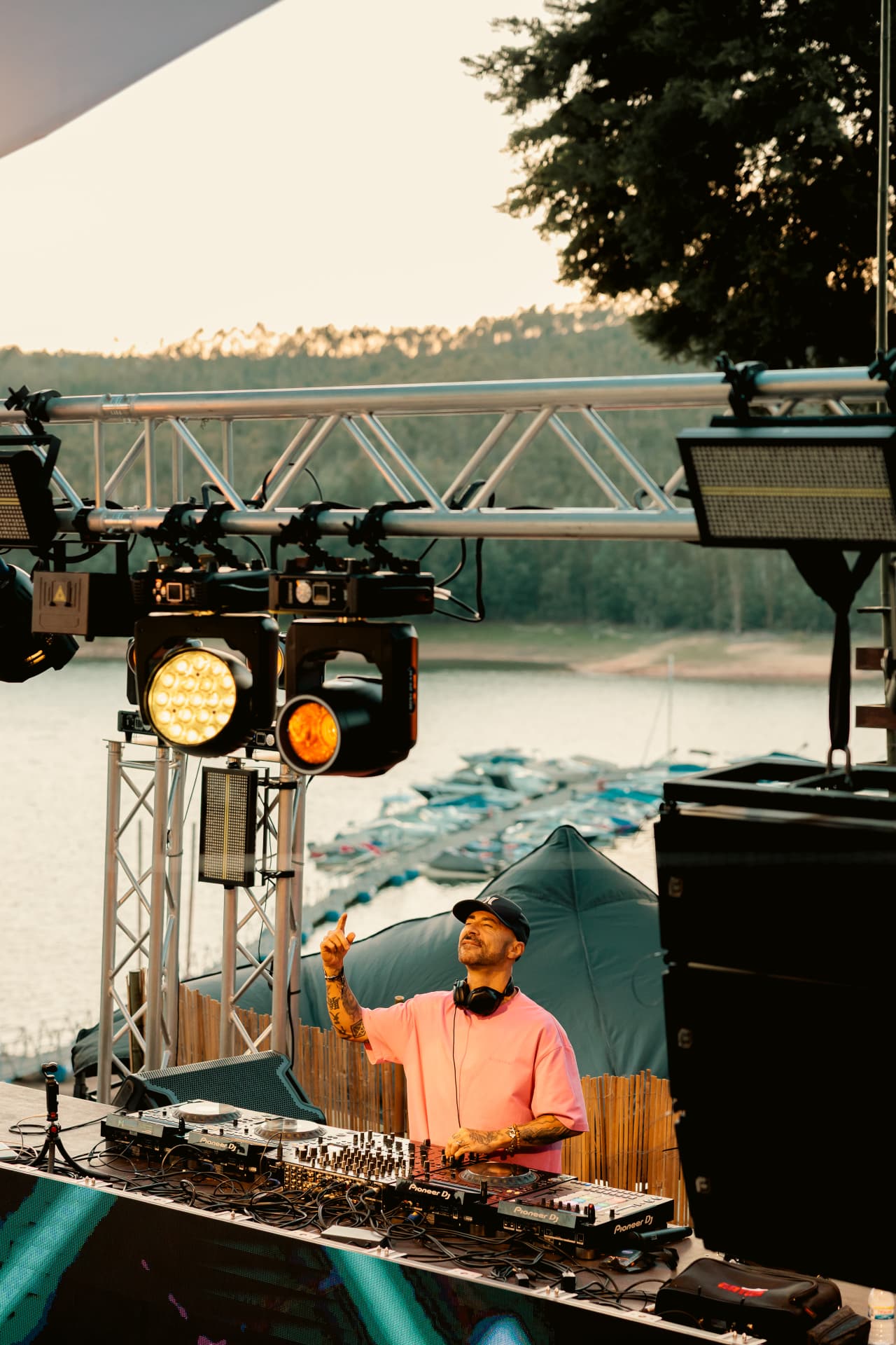 DJ with headphones above the marina