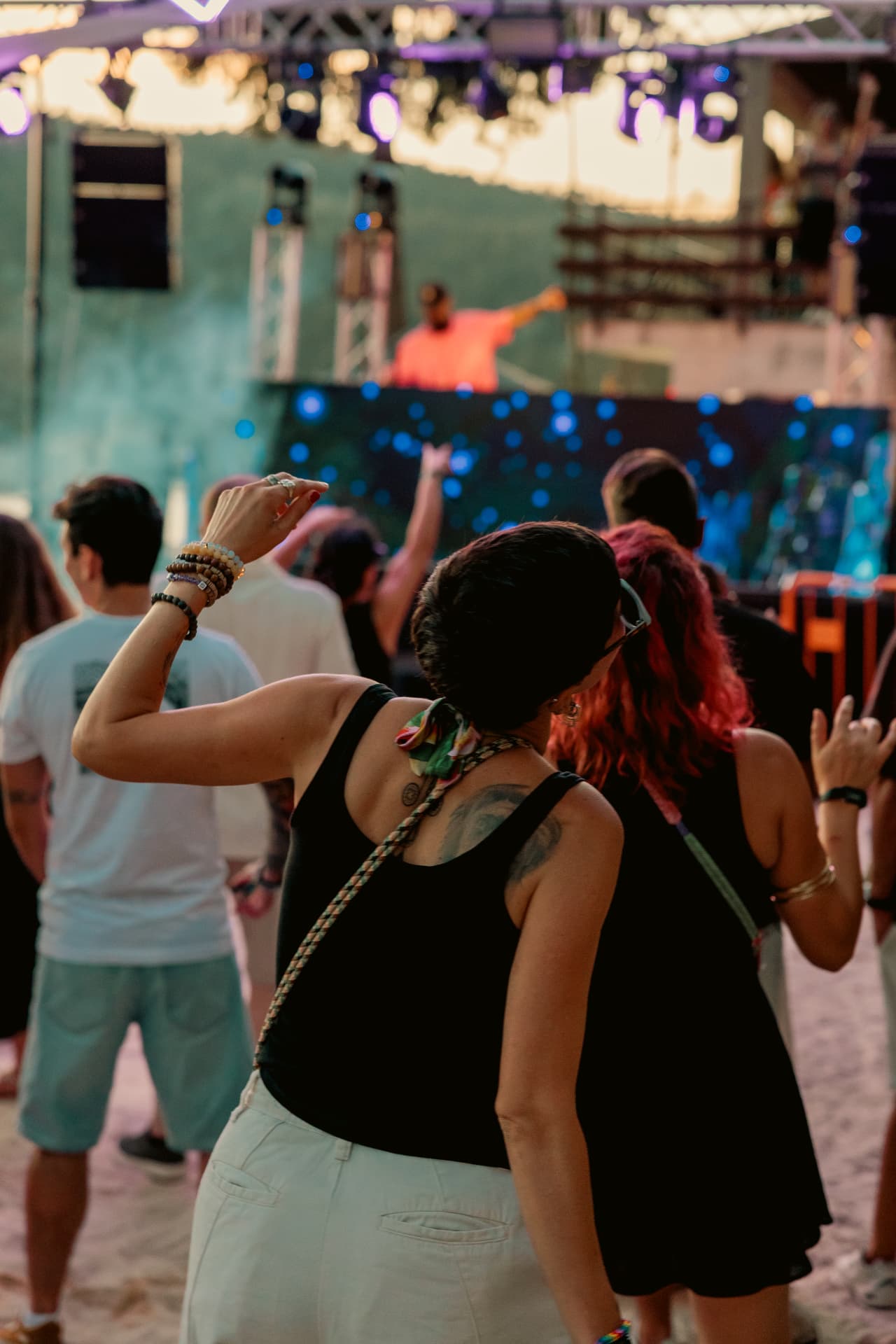Woman dancing in front of the stage in the last daylight