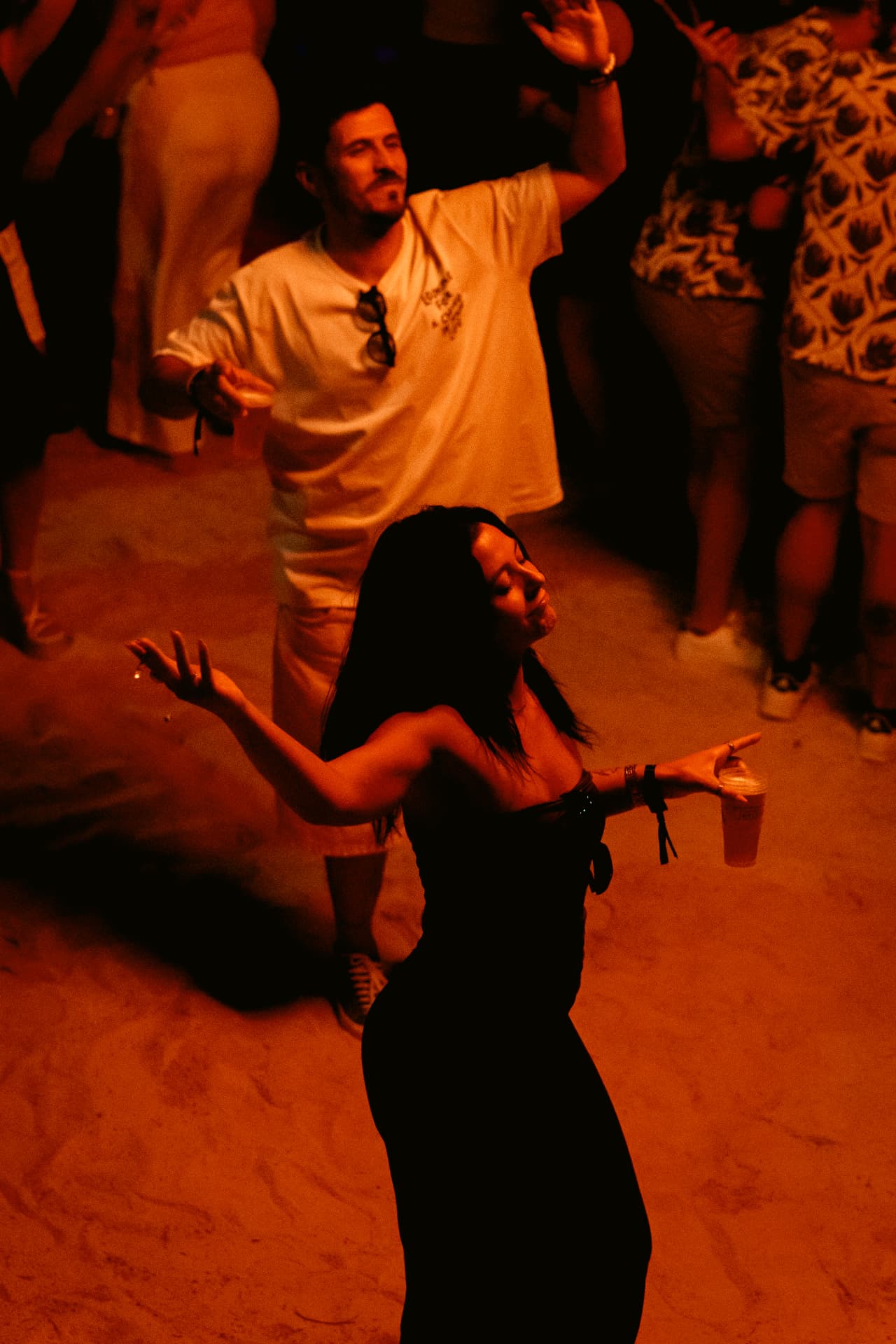 Woman dancing in red and orange light